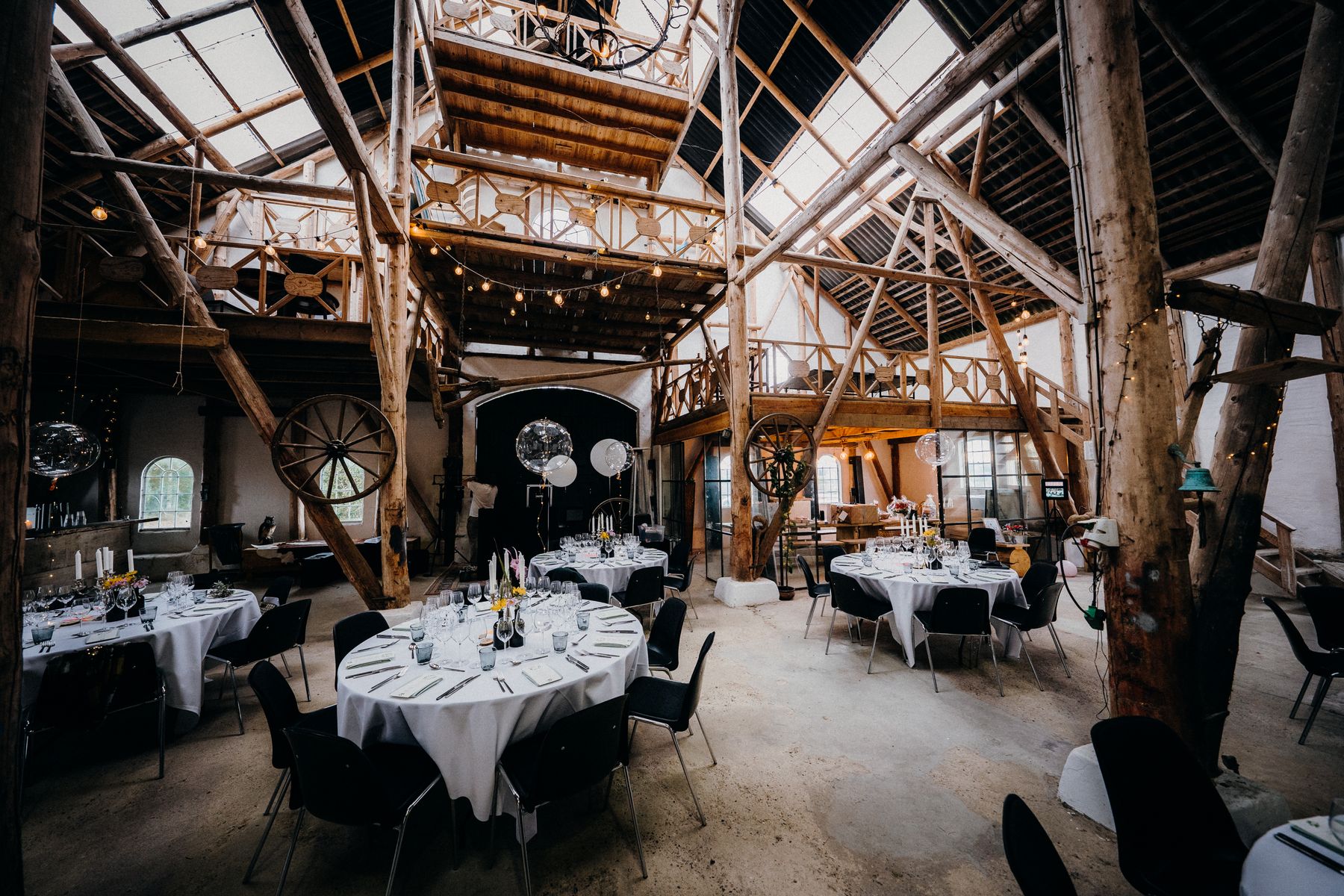 Reception tables set inside the ranch hall