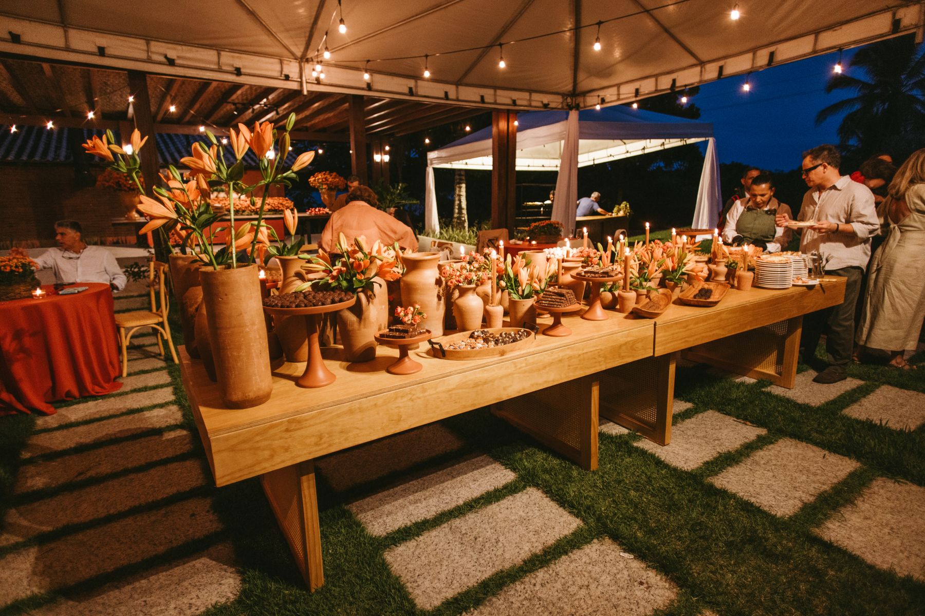 Long dinner table under warm lights
